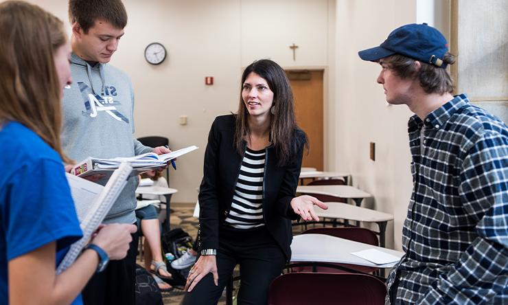 Julie Kettman with three students